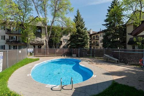 1107-650 Kenaston Blvd, Winnipeg, MB - Outdoor With In Ground Pool