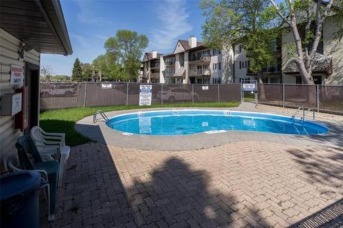 1107-650 Kenaston Blvd, Winnipeg, MB - Outdoor With In Ground Pool