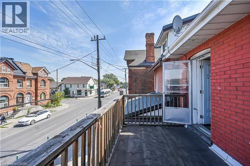 Balcony with wood railing offering street exposure - 334 Cannon Street E, Hamilton, ON - Outdoor With Balcony