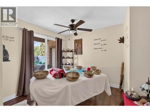 Main Floor Bedroom - 6415 Glendora Way, Coldstream, BC - Indoor Photo Showing Bedroom