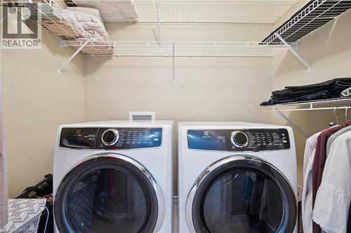 Main floor laundry (tucked neatly away in the primary bedroom). - 187 Westchester Drive, Kitchener, ON - Indoor Photo Showing Laundry Room
