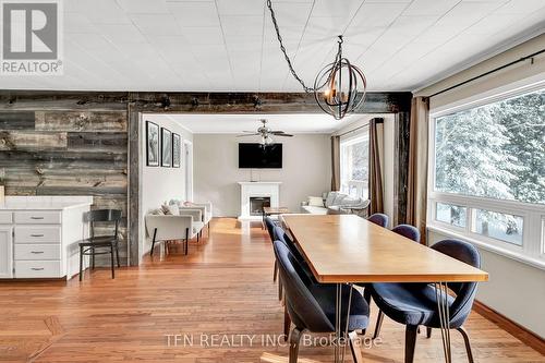 322 Concession Road W, Tiny, ON - Indoor Photo Showing Dining Room With Fireplace