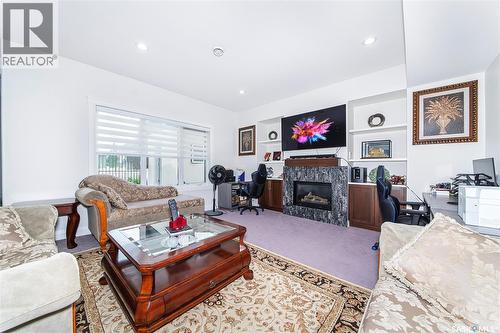 733 Gowan Road, Warman, SK - Indoor Photo Showing Living Room With Fireplace