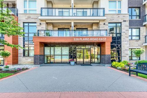 303 - 320 Plains Road E, Burlington, ON - Outdoor With Balcony With Facade