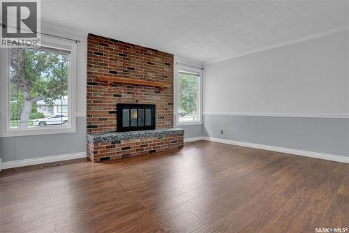 6015 7Th Avenue N, Regina, SK - Indoor Photo Showing Living Room With Fireplace