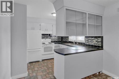 6015 7Th Avenue N, Regina, SK - Indoor Photo Showing Kitchen With Double Sink
