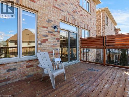 Expansive outdoor deck featuring wood-finish flooring and a privacy fence - 584 Pinery Trail, Waterloo, ON - Outdoor With Deck Patio Veranda With Exterior