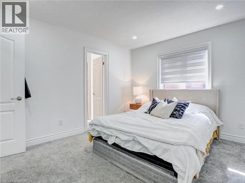 Bedroom featuring plush gray carpet flooring, white walls, and bright white trim - 584 Pinery Trail, Waterloo, ON - Indoor Photo Showing Bedroom