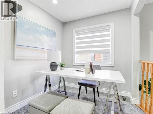 Dedicated office space featuring a single window with horizontal blinds, light gray wall paint, and gray carpeting - 584 Pinery Trail, Waterloo, ON - Indoor Photo Showing Office
