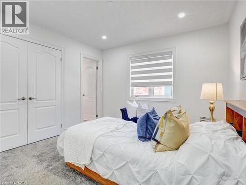 Bedroom with recessed lighting, white walls, and light-toned carpet flooring - 584 Pinery Trail, Waterloo, ON - Indoor Photo Showing Bedroom