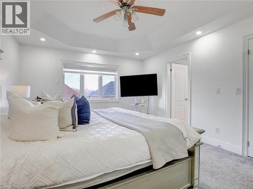 Tray ceiling with recessed lighting and a ceiling fan - 584 Pinery Trail, Waterloo, ON - Indoor Photo Showing Bedroom