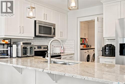 207 Kolynchuk Manor, Saskatoon, SK - Indoor Photo Showing Kitchen With Stainless Steel Kitchen With Double Sink With Upgraded Kitchen