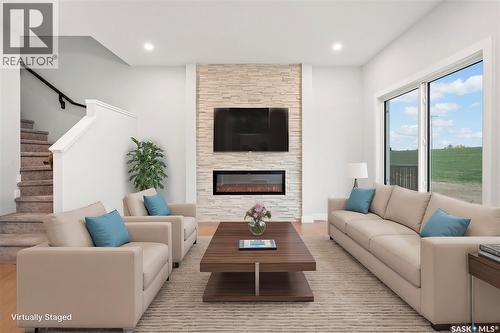 2921 Green Turtle Road, Regina, SK - Indoor Photo Showing Living Room With Fireplace