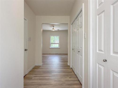 His & Hers Closets - 534 20Th Street, Brandon, MB - Indoor Photo Showing Other Room