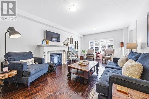32 Dulgaren Street, Hamilton, ON - Indoor Photo Showing Living Room With Fireplace