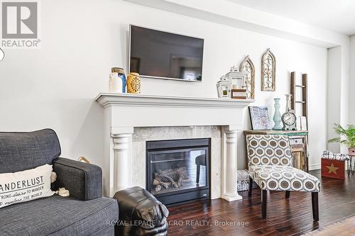 32 Dulgaren Street, Hamilton, ON - Indoor Photo Showing Living Room With Fireplace