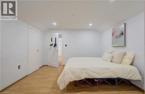 Room featuring wood-finish flooring, recessed lighting, and white baseboards - 182 Avalon Place, Kitchener, ON - Indoor Photo Showing Bedroom