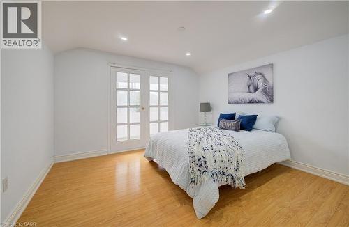 Interior space featuring wood-finish flooring, recessed lighting, and white baseboards - 182 Avalon Place, Kitchener, ON - Indoor Photo Showing Bedroom