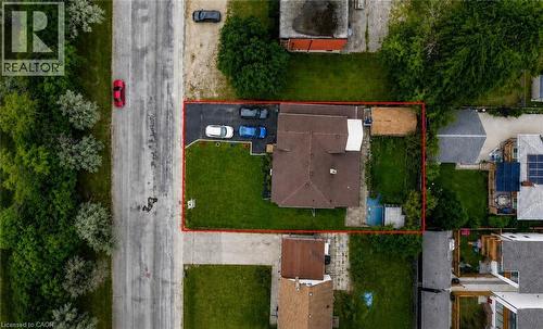 Expansive corner lot featuring a private paved driveway, a large rear yard, and a detached outbuilding - 182 Avalon Place, Kitchener, ON - Outdoor