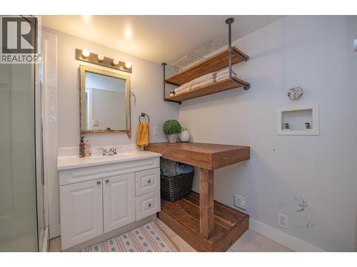 Basement bathroom with laundry hookups - 9211 6 Highway, Coldstream, BC - Indoor Photo Showing Bathroom