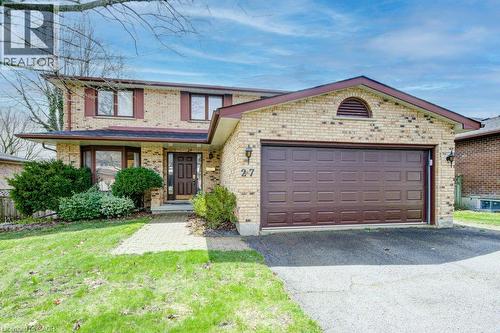 Brick exterior with a prominent two-car garage - 27 Walmer Gardens, London, ON - Outdoor