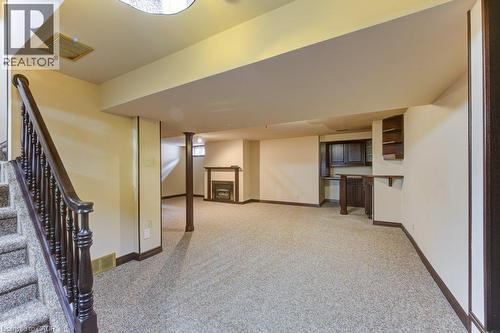 Spacious basement featuring polished concrete flooring, recessed ceiling lighting, and abundant natural light from upper windows - 27 Walmer Gardens, London, ON - Indoor Photo Showing Other Room
