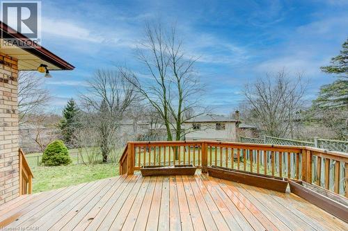 Spacious wooden deck with natural wood railing overlooking a grassy yard - 27 Walmer Gardens, London, ON - Outdoor With Deck Patio Veranda