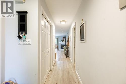 Hallway featuring light wood-finish flooring, light grey wall paint, and white paneled doors - 907 Doon Village Road, Kitchener, ON - Indoor Photo Showing Other Room