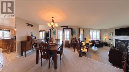12 Rainbow Trail, Mindemoya, ON - Indoor Photo Showing Dining Room With Fireplace