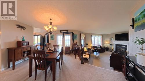 12 Rainbow Trail, Mindemoya, ON - Indoor Photo Showing Dining Room With Fireplace