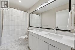Dual vanity with undermount sinks and chrome fixtures - 