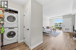 Integrated stacked laundry appliances within a dedicated closet - 