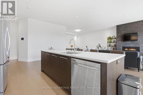 207 - 1705 Fiddlehead Place, London North (North R), ON - Indoor Photo Showing Kitchen With Fireplace