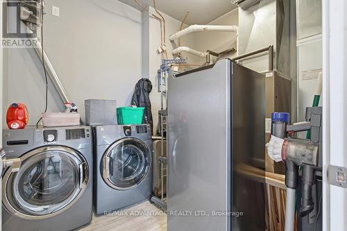 Owned HVAC system and hot water tank - 207 - 1705 Fiddlehead Place, London North (North R), ON - Indoor Photo Showing Laundry Room
