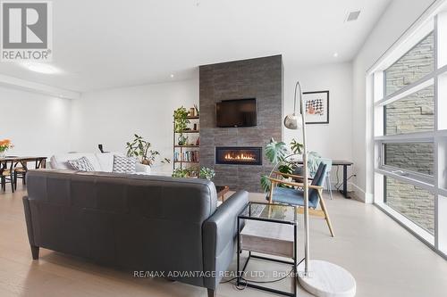 Gas fireplace - 207 - 1705 Fiddlehead Place, London North (North R), ON - Indoor Photo Showing Living Room With Fireplace