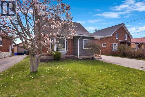 Brick exterior with an asphalt shingle roof - 371 Ottawa Street S, Kitchener, ON - Outdoor With Exterior