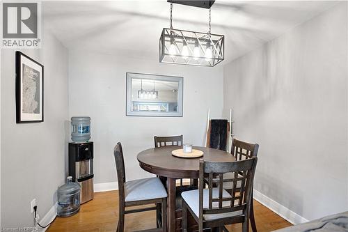 Light gray walls with white trim and wood-finish flooring - 371 Ottawa Street S, Kitchener, ON - Indoor Photo Showing Kitchen With Double Sink