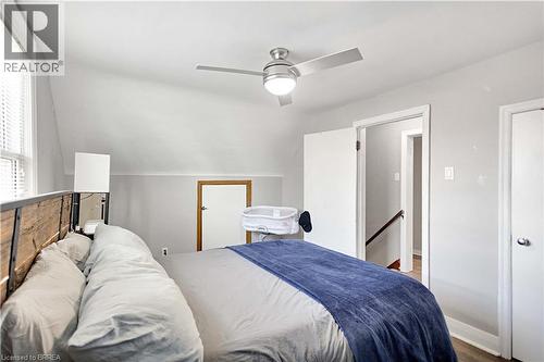 Bedroom featuring a vaulted ceiling and window with blinds - 371 Ottawa Street S, Kitchener, ON - Indoor