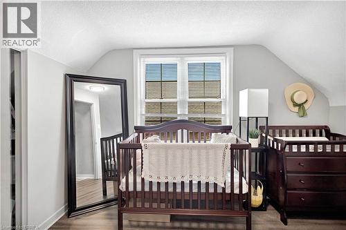 Room with sloped ceilings, light gray walls, white trim, and a window with horizontal blinds - 371 Ottawa Street S, Kitchener, ON - Indoor Photo Showing Bedroom