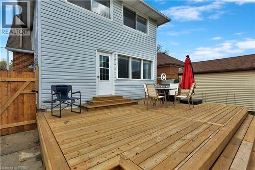 Expansive wood deck with multi-level design and direct access to the interior - 371 Ottawa Street S, Kitchener, ON - Outdoor With In Ground Pool