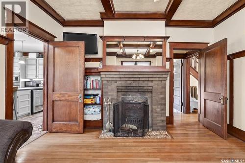 1037 Chestnut Avenue, Moose Jaw, SK - Indoor Photo Showing Living Room With Fireplace