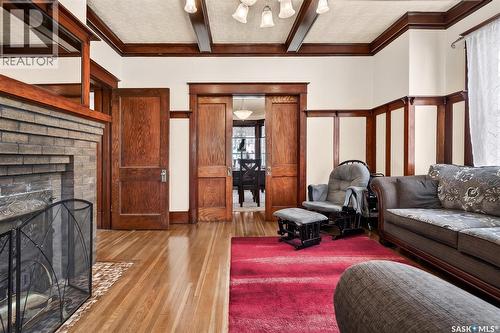 1037 Chestnut Avenue, Moose Jaw, SK - Indoor Photo Showing Living Room With Fireplace