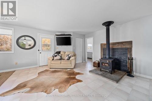 1019 Turner Way, Frontenac (Frontenac Centre), ON - Indoor Photo Showing Living Room With Fireplace