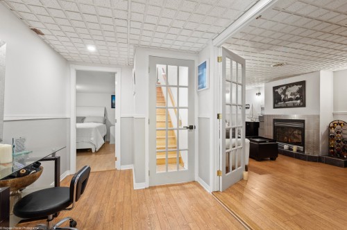 Salle familiale - 243 32E Avenue, Sainte-Marthe-Sur-Le-Lac, QC - Indoor With Fireplace