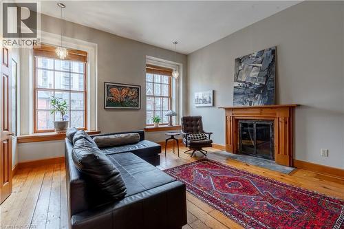 212 Bay Street S, Hamilton, ON - Indoor Photo Showing Living Room With Fireplace
