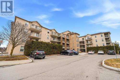 306 - 1440 Bishops Gate, Oakville, ON - Outdoor With Balcony With Facade