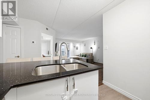 306 - 1440 Bishops Gate, Oakville, ON - Indoor Photo Showing Kitchen With Double Sink