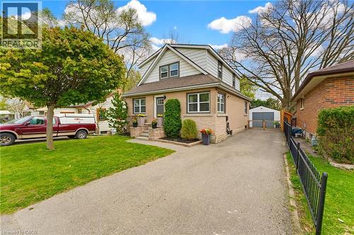 Two-story residence featuring light-colored brick and white siding - 60 Avenue Road, Cambridge, ON - Outdoor