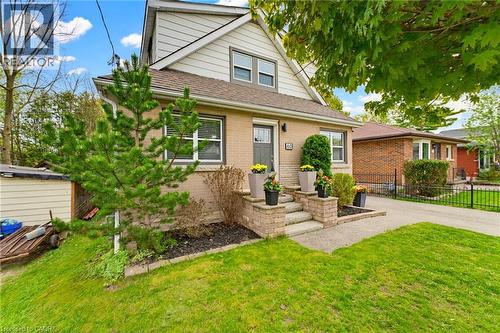 Brick and siding exterior featuring a multi-level entryway with stone-clad steps and planters - 60 Avenue Road, Cambridge, ON - Outdoor