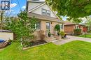 Brick and siding exterior featuring a multi-level entryway with stone-clad steps and planters - 60 Avenue Road, Cambridge, ON  - Outdoor 